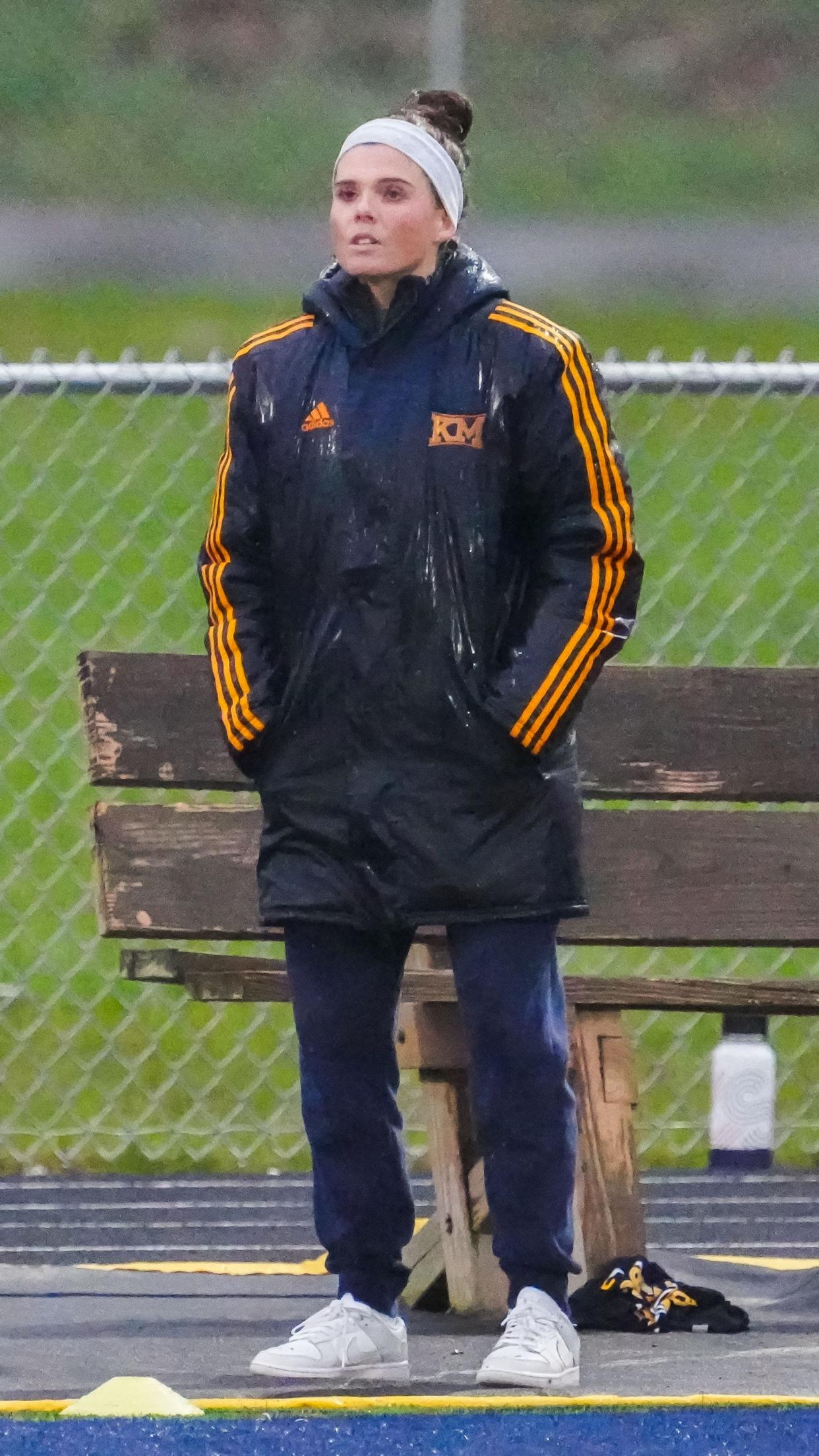 Kettle Moraine head coach Kaitlin Kapitan follows the action during the match at home against Brookfield East on Thursday.