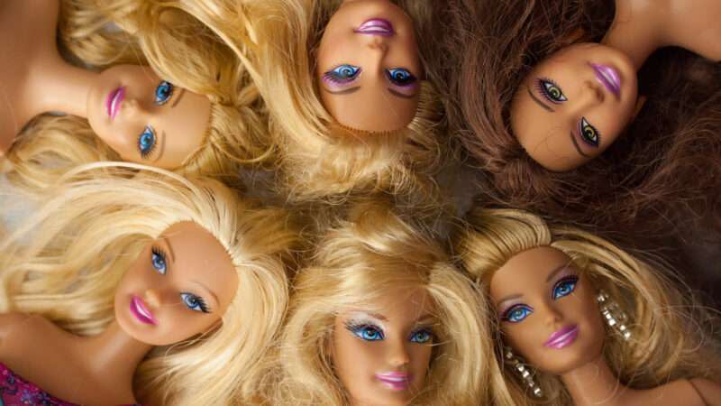 Faces of six Barbie dolls looking up