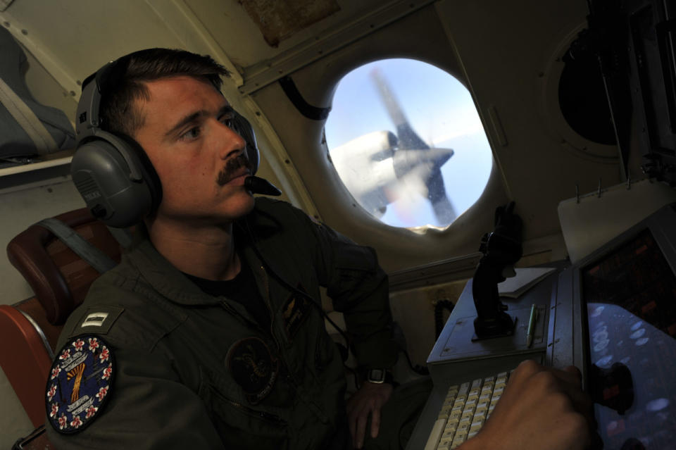 U.S. Navy LT. JG Dylon Porlas checks a screen aboard U.S. Navy Lockheed P-3C Orion patrol aircraft from Sigonella, Sicily, Sunday, May 22, 2016, searching the area in the Mediterranean Sea where the Egyptair flight 804 en route from Paris to Cairo went missing on May 19. (AP Photo/Salvatore Cavalli)