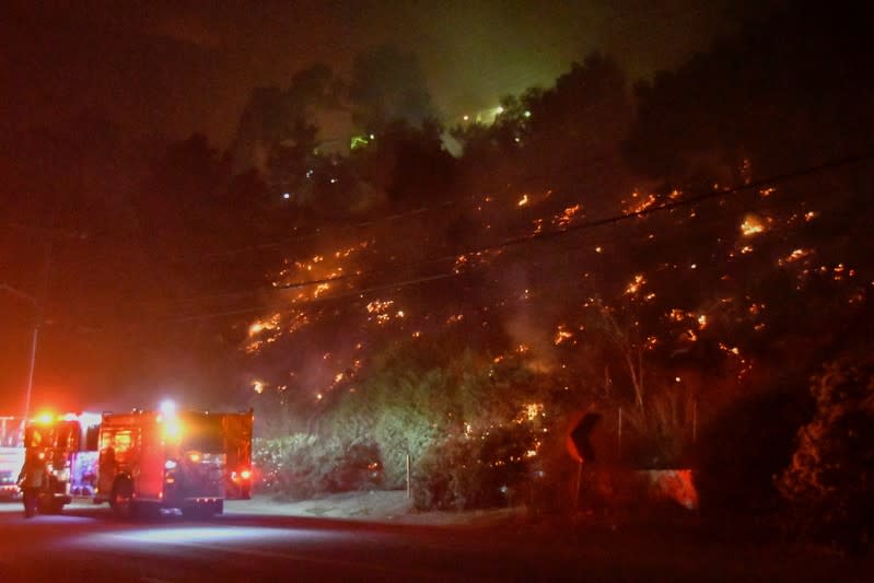 Spot fires break out on a hillside as the Getty Fire burns in west Los Angeles, California
