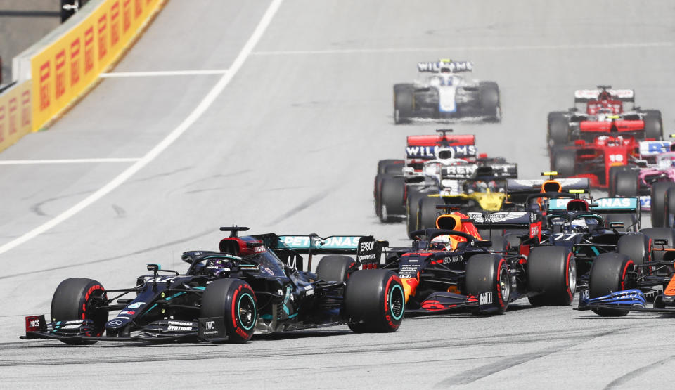 Mercedes' British driver Lewis Hamilton (L) leads from the pole position at the start of the Formula One Styrian Grand Prix race on July 12, 2020 in Spielberg, Austria. (Photo by Darko Bandic / POOL / AFP) (Photo by DARKO BANDIC/POOL/AFP via Getty Images)