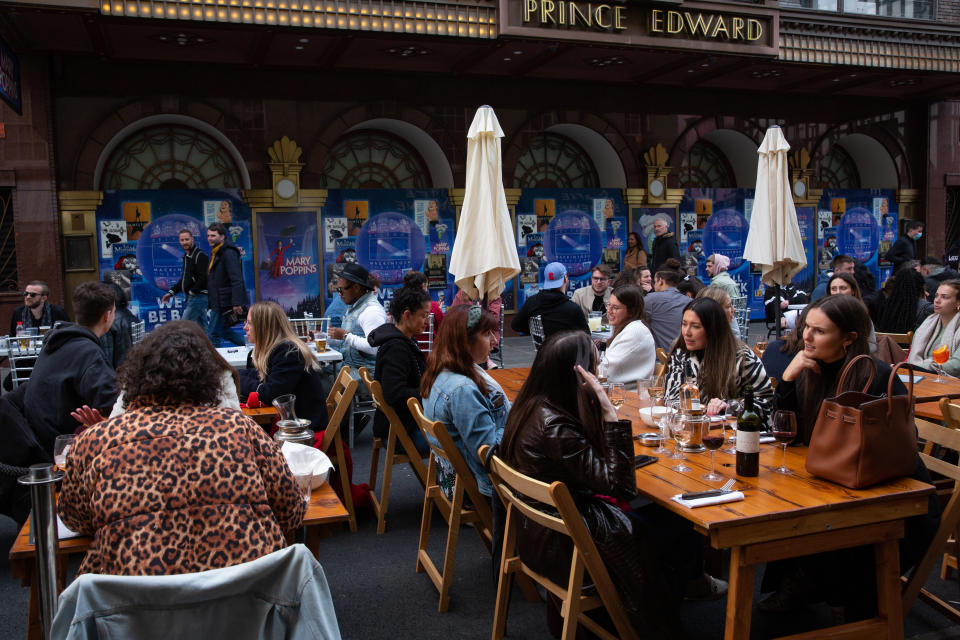 Londoners enjoy outdoor restaurants and pubs in landmark Soho district of central London as Coronavirus restrictions start to ease and the economy start to pick up in London, England on April 27, 2021. The Prime Minister Boris Johnson has set a road map on easing the restrictions. English bar and restaurants can host people in their outdoors facilities.