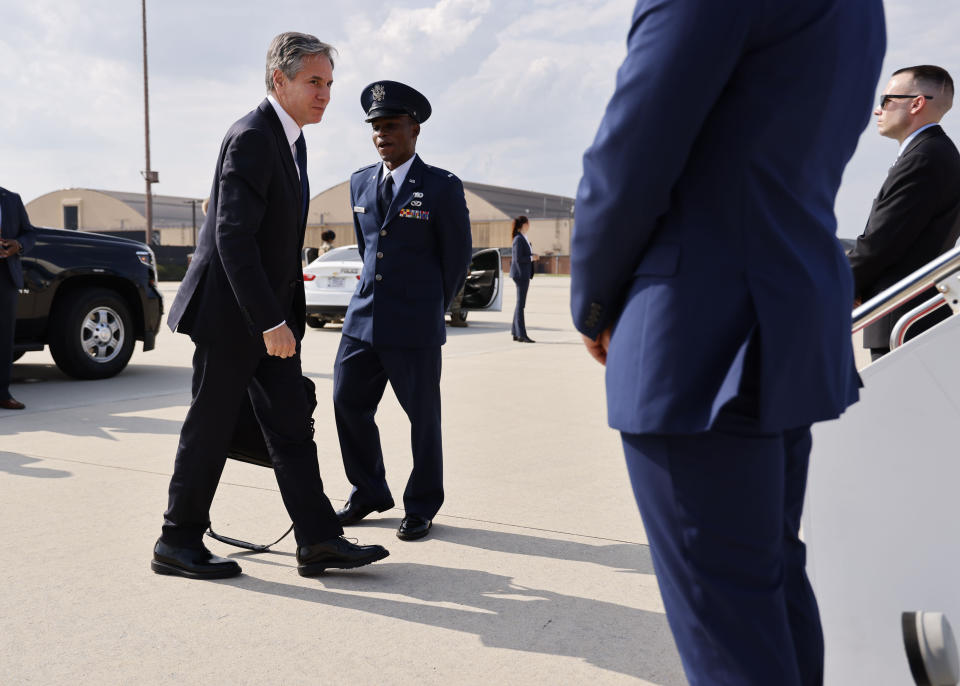 Secretary of State Antony Blinken, left, arrives to board a plane, Monday, July 26, 2021 at Andrews Air Force Base, Md., traveling to New Delhi, India and Kuwait City, Kuwait. (Jonathan Ernst/Pool via AP)
