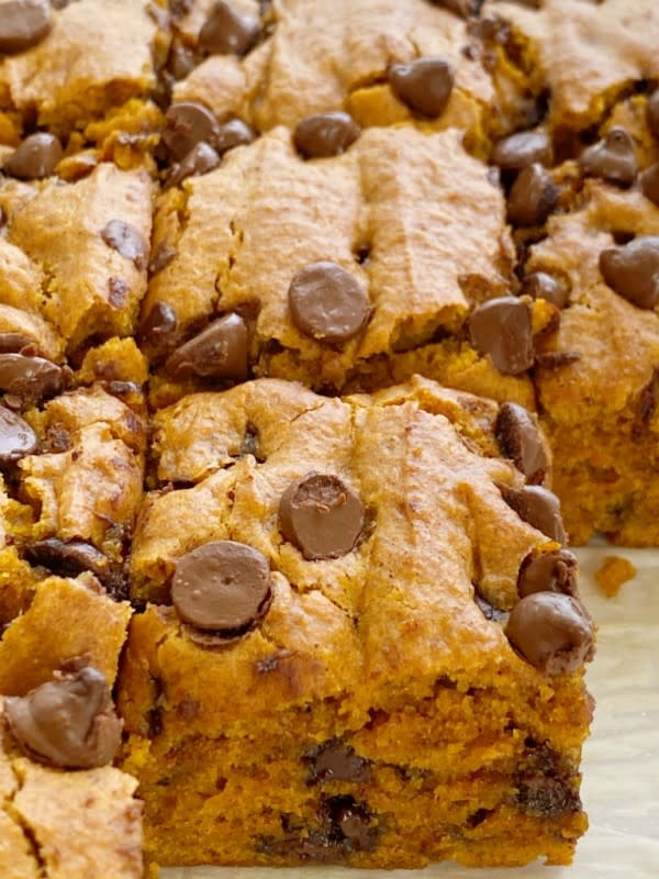 <p>Together As a Family</p><p>Pumpkin chocolate chip bars are super soft and moist, cake-like, and loaded with milk chocolate chips. They have the perfect blend of pumpkin, pumpkin pie spice and cinnamon. </p><p><strong>Get the recipe: <em><a href="https://togetherasfamily.com/pumpkin-chocolate-chip-bars/" rel="nofollow noopener" target="_blank" data-ylk="slk:Pumpkin Chocolate Chip Bars;elm:context_link;itc:0;sec:content-canvas" class="link rapid-noclick-resp">Pumpkin Chocolate Chip Bars</a></em></strong></p>