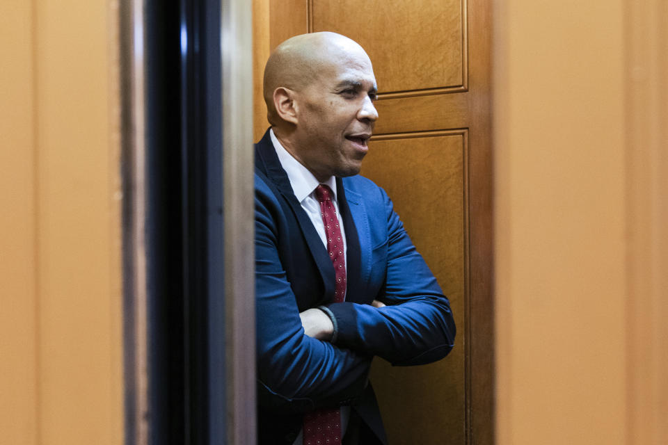FILE - Sen. Cory Booker, D-N.J., takes the elevator on Capitol Hill in Washington, Aug. 4, 2022. Booker is calling on Sen. Bob Menendez to resign, saying in a statement that the federal bribery charges unveiled on Friday against his fellow New Jersey Democrat contain ”shocking allegations of corruption and specific, disturbing details of wrongdoing.” (AP Photo/Manuel Balce Ceneta, File)