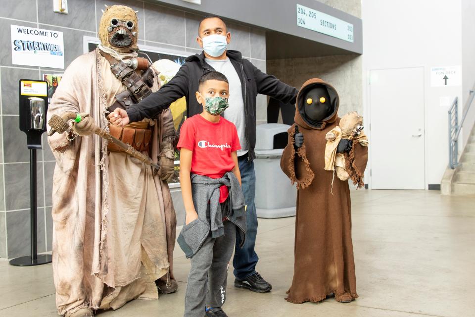 Joe Rocha and his son Jacob from Stockton pose with a Star Wars Tusken (Jamie Franscella from Modesto) and Jawa (David Buna from Sacramento) at the StocktonCon Winter Show on Jan. 16th. Dianne Rose/For The Record