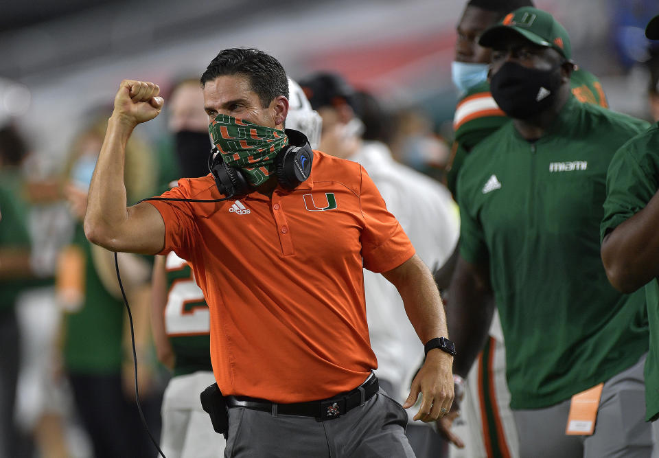 Miami head coach Manny Diaz celebrates a touchdown against Florida State during the first half of an NCAA college football game, Saturday, Sept. 26, 2020, in Miami Gardens, Fla. (Michael Laughlin/South Florida Sun-Sentinel via AP)