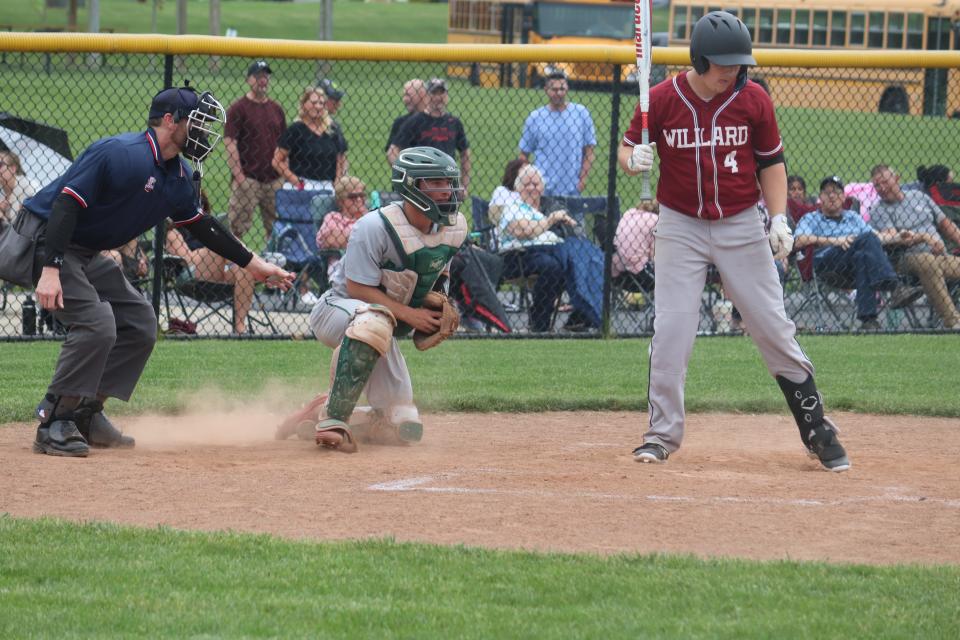 Oak Harbor's Brayden Butzin blocks a pitch.