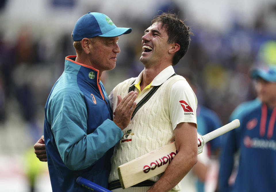 Australia captain Pat Cummins, right, celebrates with coach Andrew McDonald after beating England during day five of the first Ashes Test cricket match, at Edgbaston, Birmingham, England, Tuesday, June 20 2023. (Mike Egerton/PA via AP)