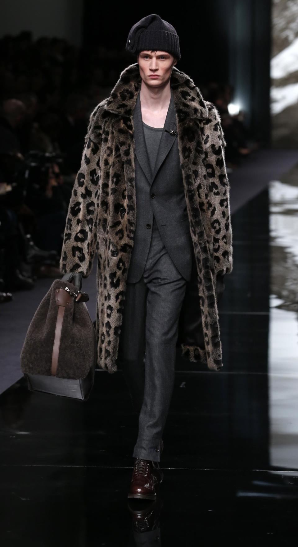 A model presents a creation by British fashion designer Kim Jones for Louis Vuitton's fall-winter 2013/2014 men's fashion collection, presented in Paris, Thursday, Jan.17, 2013. (AP Photo/Jacques Brinon)