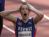 Karsten Warholm, of Norway celebrates as he wins the gold medal in the final of the men's 400-meter hurdles at the 2020 Summer Olympics, Tuesday, Aug. 3, 2021, in Tokyo, Japan. (AP Photo/Charlie Riedel)