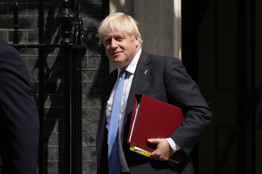 British Prime Minister Boris Johnson leaves 10 Downing Street, in London, to attend the weekly Prime Minister's Questions at the Houses of Parliament, Wednesday, July 20, 2022. The fractious race to replace Boris Johnson as Britain's prime minister entered an unpredictable endgame Tuesday as three candidates for Conservative Party leader were left battling for the two spots in a run-off vote. (AP Photo/Matt Dunham)