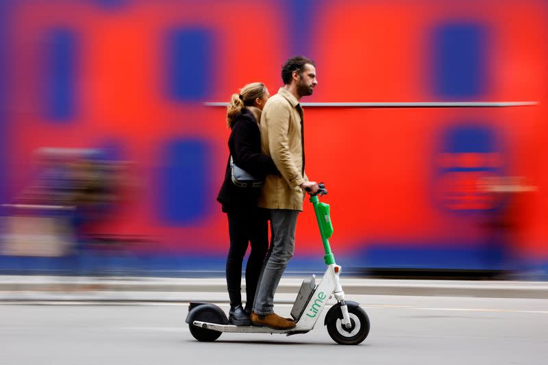 People ride electric scooters on the eve of a public vote to ban or not rental electric scooters in Paris