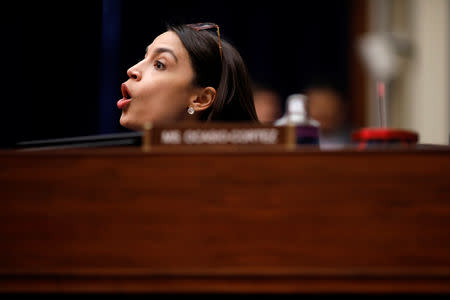 U.S. Rep. Alexandria Ocasio-Cortez (D-NY) casts her vote in the affirmative as the House Oversight and Reform Committee votes to subpoena the White House about the Trump administration's security clearance process as the committee meets on Capitol Hill in Washington, U.S., April 2, 2019. REUTERS/Carlos Barria