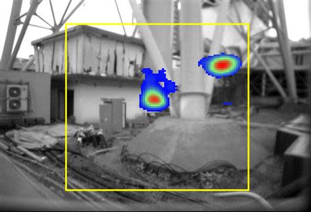 Tokyo Electric Power Co (TEPCO)'s handout shows an image taken by a gamma ray camera showing the bottom of a ventilation stack standing between Fukushima Daiichi nuclear power plant's No.1 and No.2 reactors, where radiation exceeding 10 sieverts (10,000 millisieverts) per hour was found as shown in red, in Fukushima prefecture, northern Japan July 31, 2011, released by TEPCO August 2, 2011. REUTERS/Tokyo Electric Power Co/Handout/Files