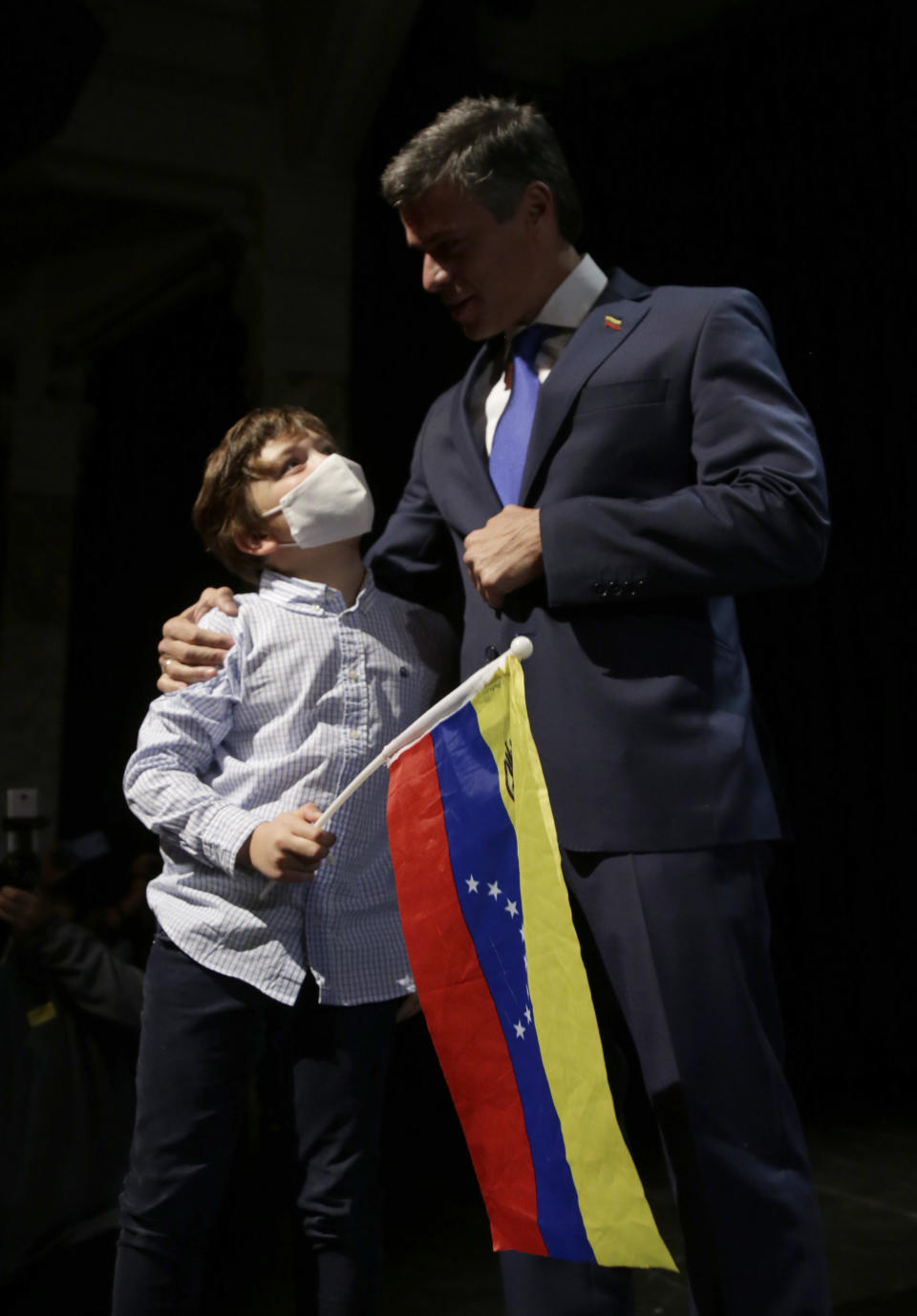 Venezuelan opposition leader Leopoldo Lopez arrives with his soon Leopoldo during press conference in Madrid on Tuesday, Oct. 27, 2020. Prominent opposition activist Leopoldo López who has abandoned the Spanish ambassador's residence in Caracas and left Venezuela after years of frustrated efforts to oust the nation's socialist president is holding a news conference in Madrid. (AP Photo/Andrea Comas)