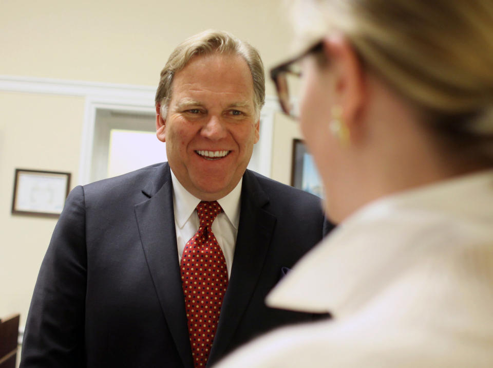 In this April 30, 2014 photo, Rep. Mike Rogers, R-Mich, smiles in his office on Capitol Hill in Washington. The daily radio show Rogers begins hosting in January will give the Michigan Republican practice talking to millions of Americans every day, and honing what he calls a “productive conservative” message talk radio is desperately lacking, he said. (AP Photo/Lauren Victoria Burke)