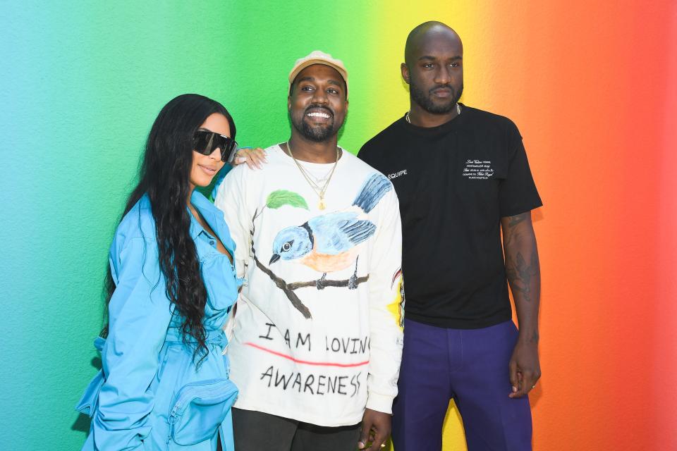 Virgil Abloh, right, poses with Kim Kardashian and Kanye West at the Louis Vuitton Menswear Spring/Summer 2019 show during Paris Fashion Week.