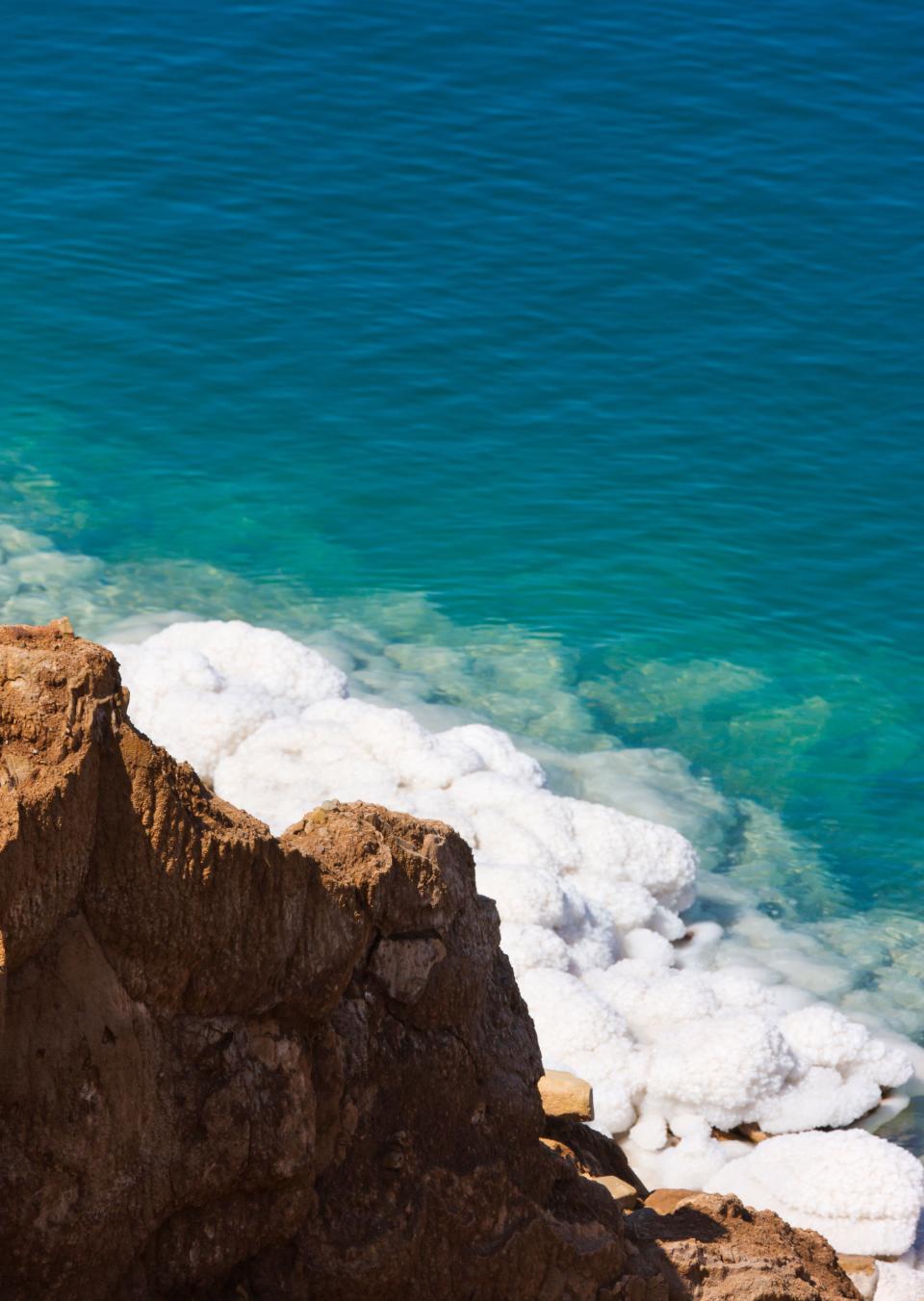 Deposits of salt form over gypsum in the cliffs of the Dead Sea in Jordan.