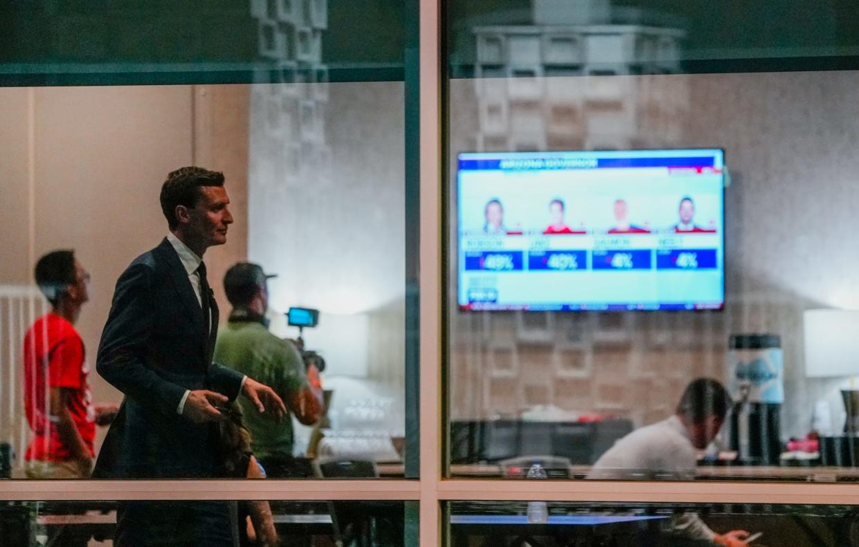 U.S. Senate candidate Blake Masters paces in a room full of his family and campaign members as they watch the primary election votes roll in at Hilton Garden Inn in Chandler on Aug. 2, 2022.