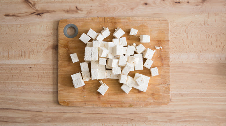 cubed tofu on cutting board 