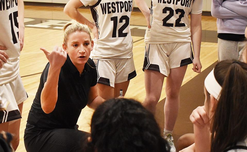 Westport's coach Jen Gargiulo talks with her team during a timeout.