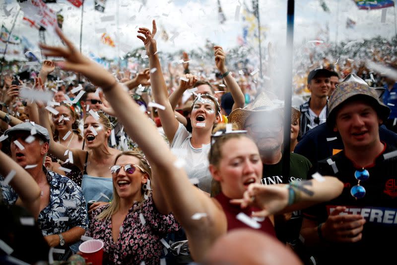 FILE PHOTO: Revellers watch Years & Years performing during the Glastonbury Festival in Somerset