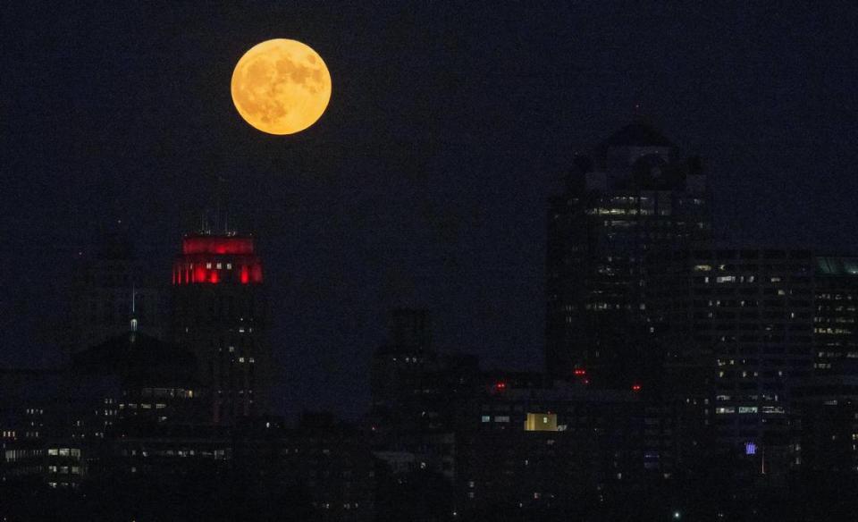 It didn’t take long for the super blue moon to clear the Kansas City skyline, lose its golden hue and shine bright white in the sky Wednesday night.