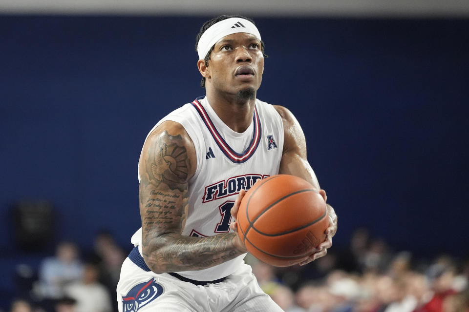 FILE - Florida Atlantic guard Alijah Martin (15) aims from the free throw line during the first half of an NCAA college basketball game against Wichita State, Thursday, Jan. 18, 2024, in Boca Raton, Fla. Florida Atlantic standout Martin, who helped propel the Owls to the Final Four in 2023, is moving about 300 miles north to play at Florida. The 6-foot-2 guard formally signed with the Gators on Monday, April 22, and is expected to become an immediate starter for coach Todd Golden in Gainesville. (AP Photo/Marta Lavandier, File)