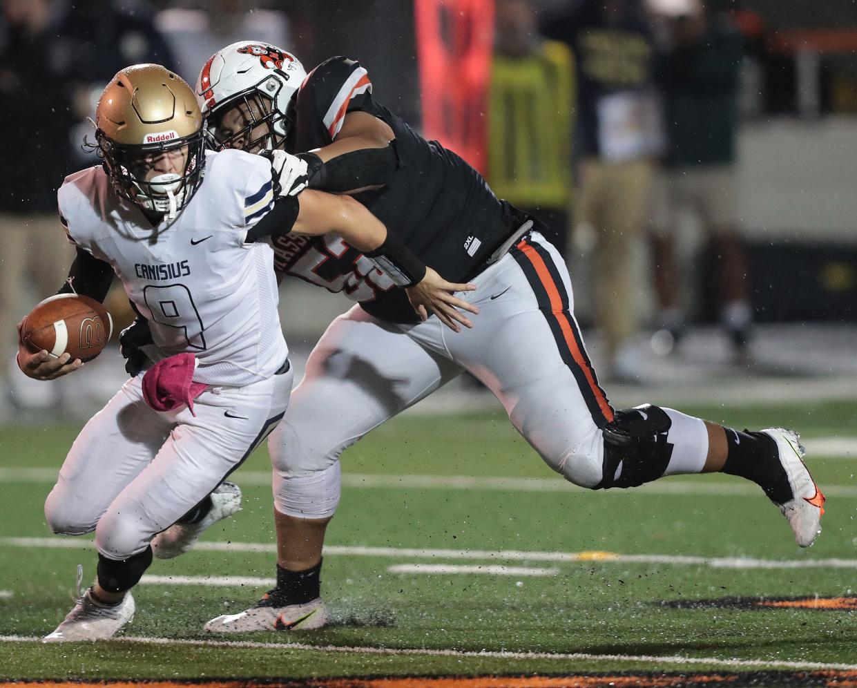 Massillon defensive lineman Marcus Moore sacks Canisius quarterback Tyler Baker in the second half at Massillon.