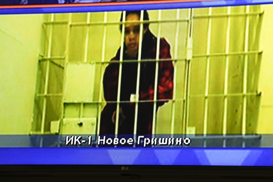 WNBA star and two-time Olympic gold medalist Brittney Griner is seen on the bottom part of a TV screen as she waits to appear in a video link provided by the Russian Federal Penitentiary Service a courtroom prior to a hearing at the Moscow Regional Court in Moscow, Russia, Tuesday, Oct. 25, 2022. A Russian court on Tuesday started hearing American basketball star Brittney Griner's appeal against her nine-year prison sentence for drug possession. (AP Photo/Alexander Zemlianichenko)