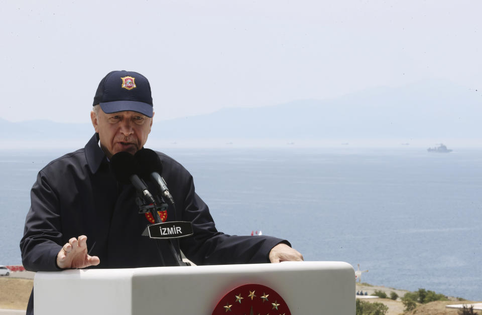 In this handout photo provided by the Turkish Presidency, Turkish President Recep Tayyip Erdogan speaks during the final day of military exercises that were taking place in Seferihisar near Izmir, on Turkey's Aegean coast, Thursday, June 9, 2022. Erdogan on Thursday warned Greece to demilitarize islands in the Aegean, saying he was "not joking" with such comments. Turkey says Greece has been building a military presence on Aegean in violation of treaties that guarantee the unarmed statues of the islands. (Turkish Presidency via AP)