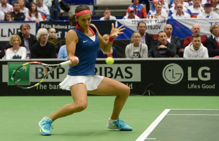 Caroline Garcia of France returns a ball to Lucie Safarova of the Czech Republic during the Fed Cup semi-final against France in Ostrava on April 18, 2015