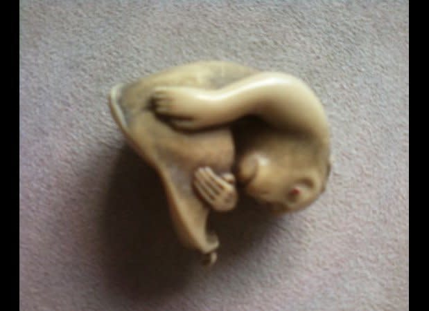 This kind of reminds us of a creature we might see in a sci-fi flick about hybrids or something. It's all curled up and scary-looking. We're not fans. And we really don't understand the purpose for such a figurine. It definitely doesn't match our decor.    Check it out at <a href="http://lasvegas.craigslist.org/atq/3208802468.html" target="_hplink">Las Vegas Craigslist. </a>