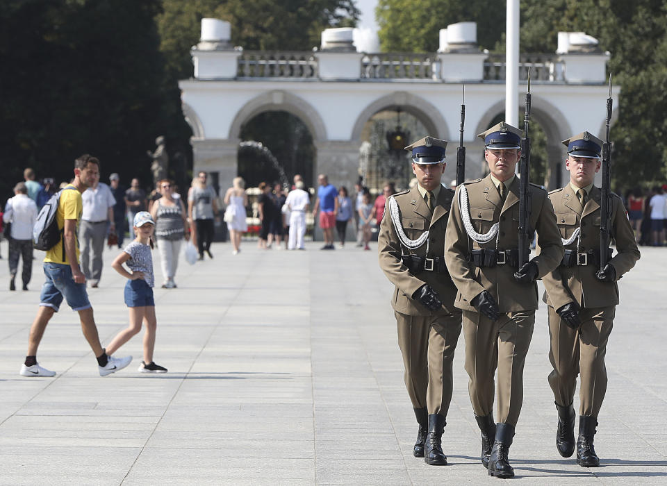 Polish soldiers take part in a changing of the guard at the Tomb of the Unknown Soldier at Pilsudski Square in Warsaw, Poland, Tuesday, Aug. 27, 2019. The square will be the site of commemorations Sunday marking the 80th anniversary of the start of World War II, to be attended by over 40 world leaders, including President Donald Trump.(AP Photo/Czarek Sokolowski)