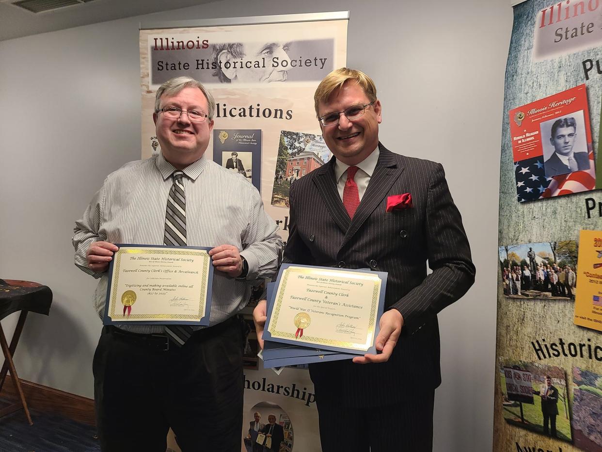 Tazewell County Chief Deputy Clerk Dan Sullivan and Tazewell County Clerk and Recorder of Deeds John Ackerman proudly display their award certificates during the Illinois State Historical Society's Best of Illinois History program in Springfield.