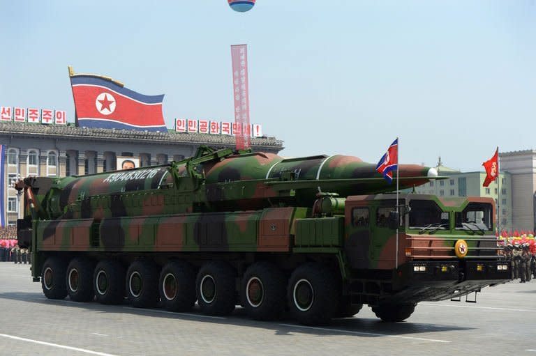 File photo taken on April 15, 2012 shows a military vehicle carrying what is believed to be a Taepodong-class missile Intermediary Range Ballistic Missile during a parade to mark the 100 years since birth of the country's founder Kim Il-Sung in Pyongyang. North Korea threatened a "pre-emptive" nuclear strike against the United States and any other aggressors Thursday