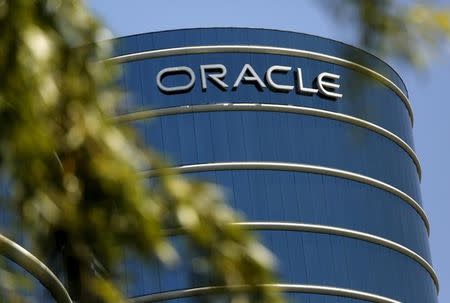 The Oracle logo is seen on its campus in Redwood City, California June 15, 2015. REUTERS/Robert Galbraith