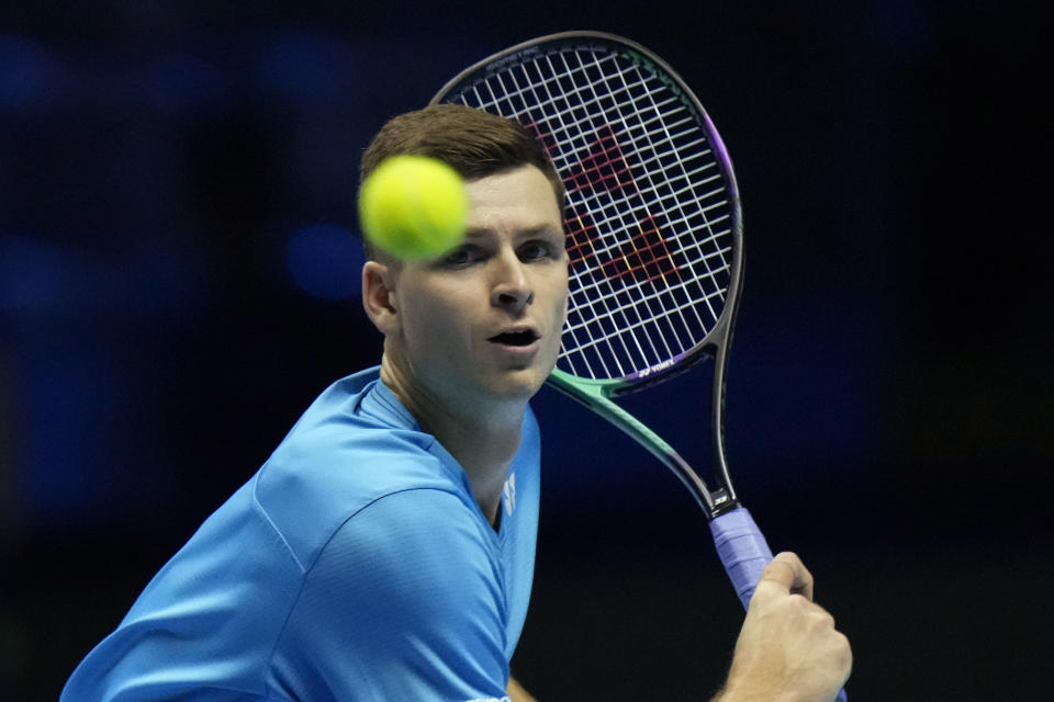 Hubert Hurkacz of Poland returns the ball to Danil Medvedev of Russia during their ATP World Tour Finals singles tennis match, at the Pala Alpitour in Turin, Sunday, Nov. 14, 2021. (AP Photo/Luca Bruno)