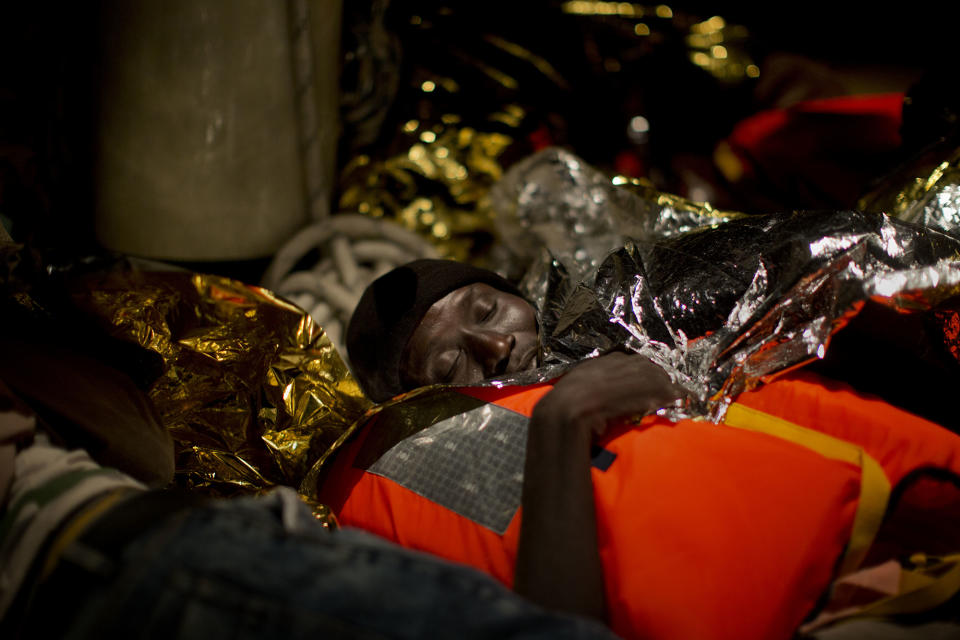 <p>A refugee from Eritrea sleeps on the Astral vessel after being rescued from the Mediterranean sea, about 13 miles north of Sabratha, Libya, Monday, Aug. 29, 2016. (AP Photo/Emilio Morenatti) </p>