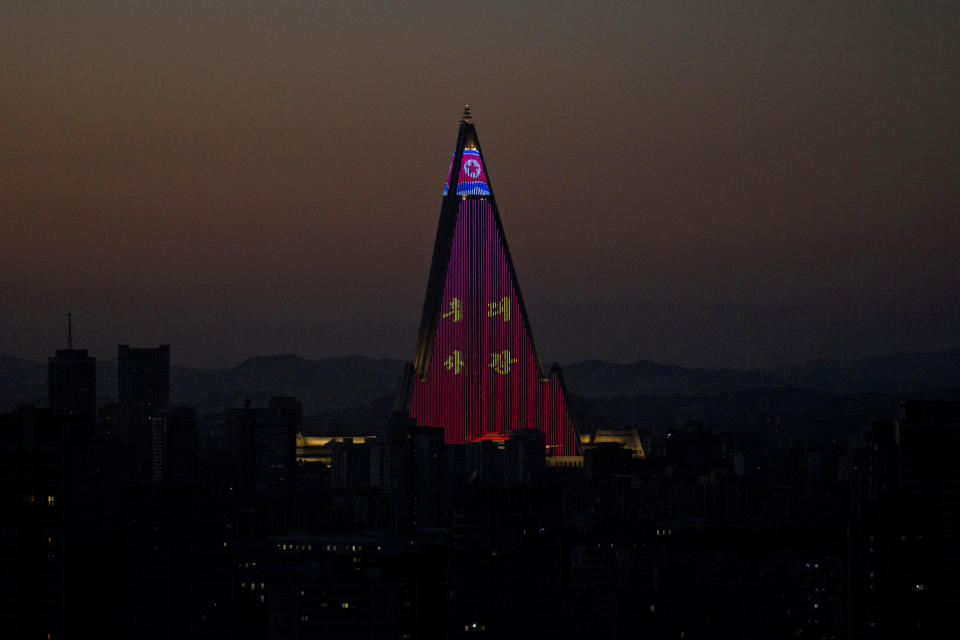 The Ryugyong Hotel is illuminated as the capital prepares for the 70th anniversary of North Korea's founding day in Pyongyang, North Korea, Friday, Sept. 7, 2018. North Korea will be staging a major military parade, huge rallies and reviving its iconic mass games on Sunday to mark its 70th anniversary as a nation. (AP Photo/Ng Han Guan)