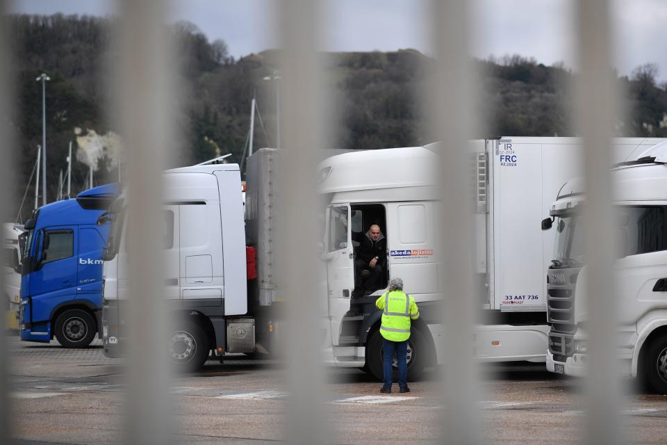 Drivers wait with their parked-up freight trucks at the Motis freight clearance centre at the port of Dover on the south coast of England on January 15, 2021, as hauliers get used to life under the post-Brexit trade deal. - British companies are struggling with a large amount of red tape as a result of Brexit, with senior government minister Michael Gove recently admitting that there would be 