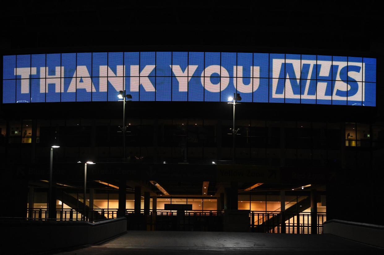 Wembley Arch is illuminated in blue to show its appreciation to the NHS amid the coronavirus outbreak in London, after Prime Minister Boris Johnson ordered pubs and restaurants across the country to close tonight as the Government announced unprecedented measures to cover the wages of workers who would otherwise lose their jobs due to the coronavirus outbreak.