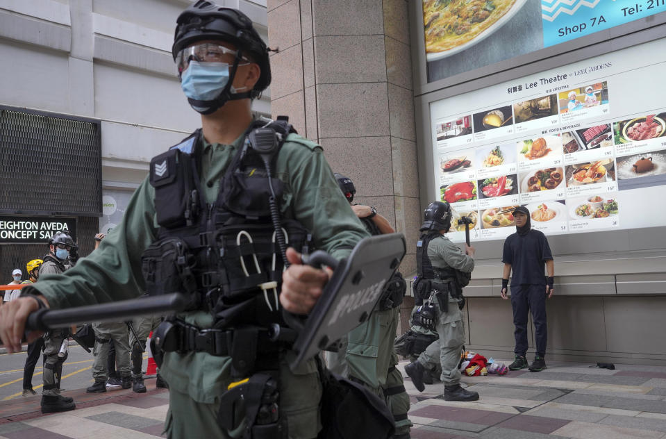 Police detain protesters during the annual handover march in Hong Kong, Wednesday, July. 1, 2020. Hong Kong marked the 23rd anniversary of its handover to China in 1997, and just one day after China enacted a national security law that cracks down on protests in the territory. Hong Kong police said on Facebook they had arrested over 30 people on various charges, from unlawful assembly to the violation of a national security law on the first day of the law. (AP Photo/Kin Cheung) (AP Photo/Vincent Yu)