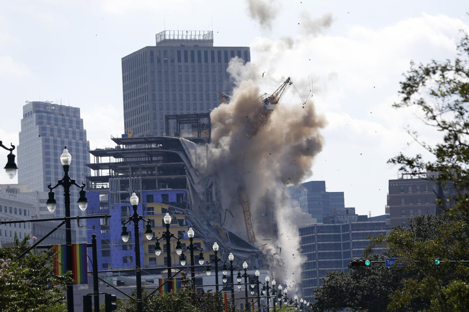 FILE - Two large cranes from the Hard Rock Hotel construction collapse come crashing down after being detonated for implosion in New Orleans, Sunday, Oct. 20, 2019. A grand jury in Louisiana on Thursday, Oct. 5, 2023, has decided against indicting anyone in the deadly collapse hotel that had been under construction in New Orleans. (AP Photo/Gerald Herbert, File)