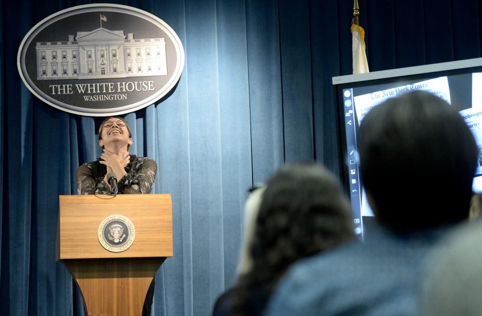 Royal High School senior Gabi Muñoz breaks character as president of the United States and starts laughing during a mock press conference at the Ronald Reagan Presidential Library & Museum in Simi Valley Tuesday.