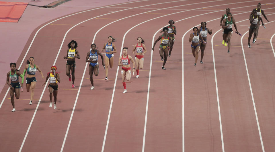 FILE - Competitors race in a women's 4x100 meter relay semifinal at the World Athletics Championships in Doha, Qatar, Friday, Oct. 4, 2019. The World Cup is just one way Qatar is using its massive wealth to project influence. By buying sports teams, hosting high-profile events, and investing billions in European capitals — such as buying London’s The Shard skyscraper — Qatar has been integrating itself into international finance and a network of support. (AP Photo/Nariman El-Mofty, File)