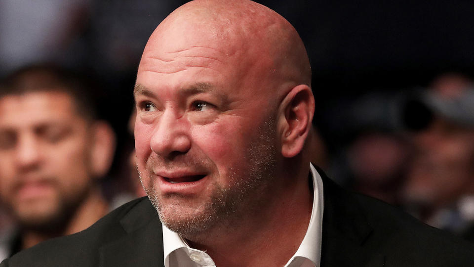 Dana White is pictured spectating a UFC match ringside.