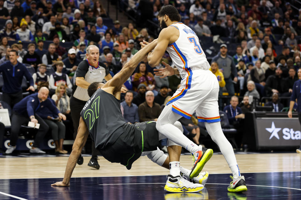 MINNEAPOLIS, MN - DECEMBER 03: Kenrich Williams #34 of the Oklahoma City Thunder and Rudy Gobert #27 of the Minnesota Timberwolves get into a scrum in the second quarter of the game at Target Center on December 3, 2022 in Minneapolis, Minnesota. Gobert was ejected after getting assessed a flagrant two foul. NOTE TO USER: User expressly acknowledges and agrees that, by downloading and or using this Photograph, user is consenting to the terms and conditions of the Getty Images License Agreement. (Photo by David Berding/Getty Images)