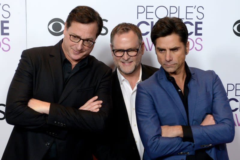 Bob Saget, Dave Coulier and John Stamos, from left to right, attend the People's Choice Awards in 2017. File Photo by Jim Ruymen/UPI